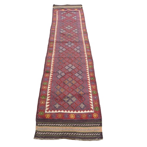 331 - Meshwani Runner hand knotted woollen rug, 260 by 56cm.