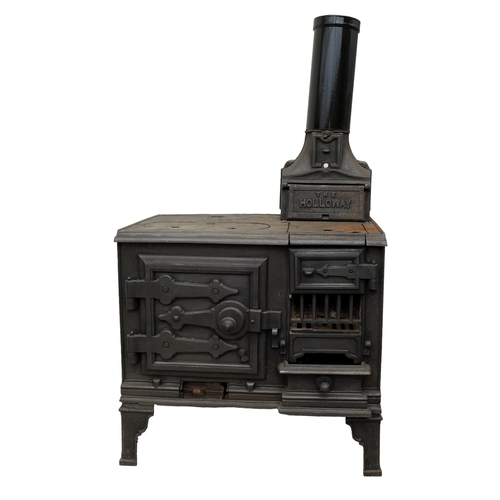 264 - A cast iron stove, 'The Holloway', with hot plates to the surface and two ovens, with flue, raised o... 