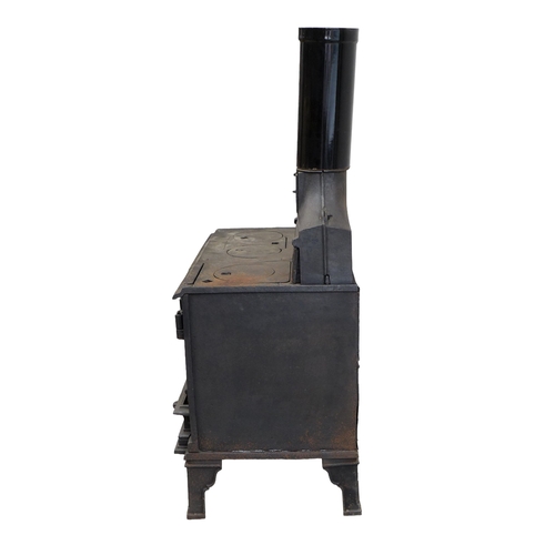 264 - A cast iron stove, 'The Holloway', with hot plates to the surface and two ovens, with flue, raised o... 