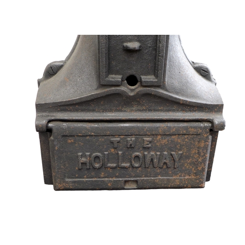 264 - A cast iron stove, 'The Holloway', with hot plates to the surface and two ovens, with flue, raised o... 