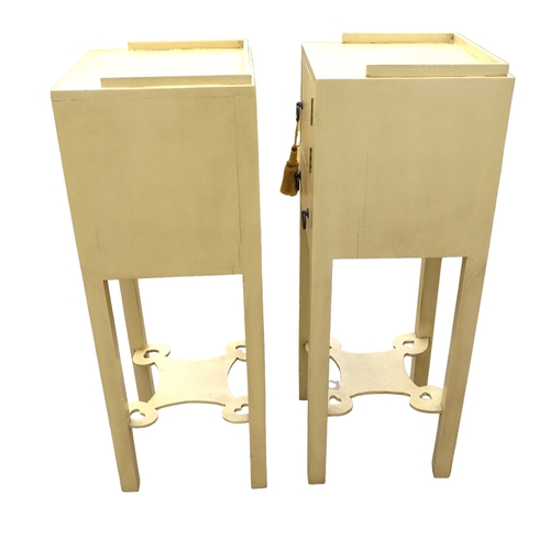 298 - A pair of modern bedside cabinets, painted cream, each with a single door and drawer below with ring... 