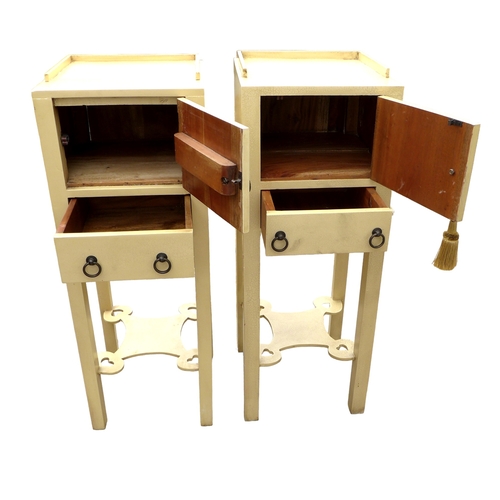 298 - A pair of modern bedside cabinets, painted cream, each with a single door and drawer below with ring... 