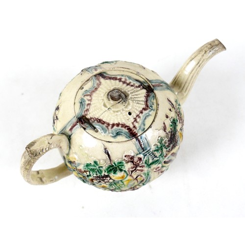 128 - A Staffordshire creamware teapot, circa 1765, probably by William Greatbatch, of ovoid form decorate... 