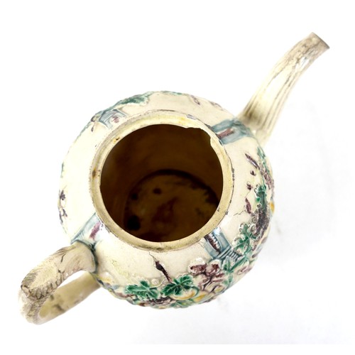 128 - A Staffordshire creamware teapot, circa 1765, probably by William Greatbatch, of ovoid form decorate... 