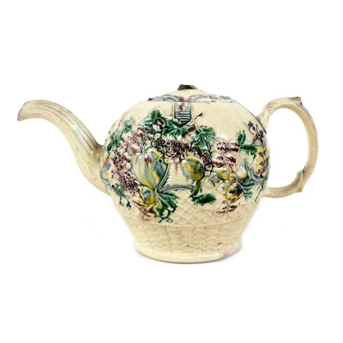 128 - A Staffordshire creamware teapot, circa 1765, probably by William Greatbatch, of ovoid form decorate... 