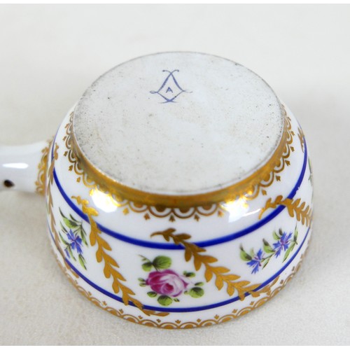 125 - An 18th century Sèvres porcelain saucepan, circa 1780, decorated with nine floral sprigs separated b... 