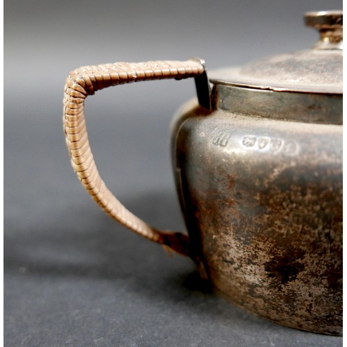 1 - A Victorian silver bachelor's teapot, with rattan handle, registration stamp to base, Jonathan Wilso... 