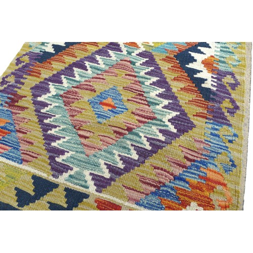 335 - A Chobi Kilim Runner hand knotted woollen rug, 144 by 63cm.