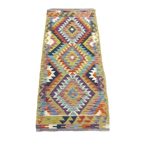 335 - A Chobi Kilim Runner hand knotted woollen rug, 144 by 63cm.