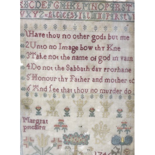 215 - A George II needlework sampler, pictorial and prose by Margrat Pitcairn. Housed in a modern frame, s... 