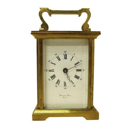 256 - A brass carriage clock signed Bernard Freres, 8 by 6 by 14.5 cm.