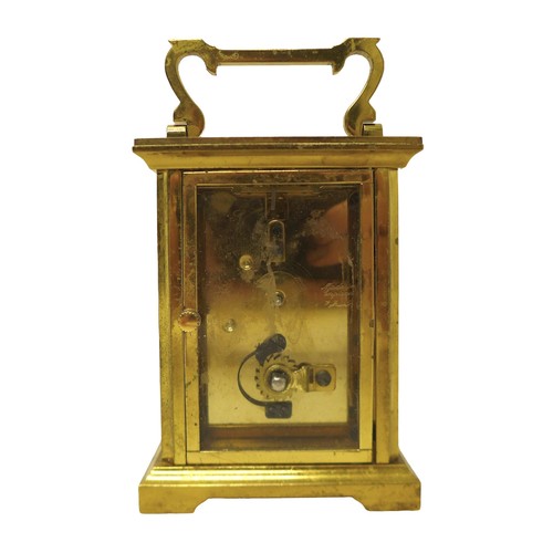 256 - A brass carriage clock signed Bernard Freres, 8 by 6 by 14.5 cm.