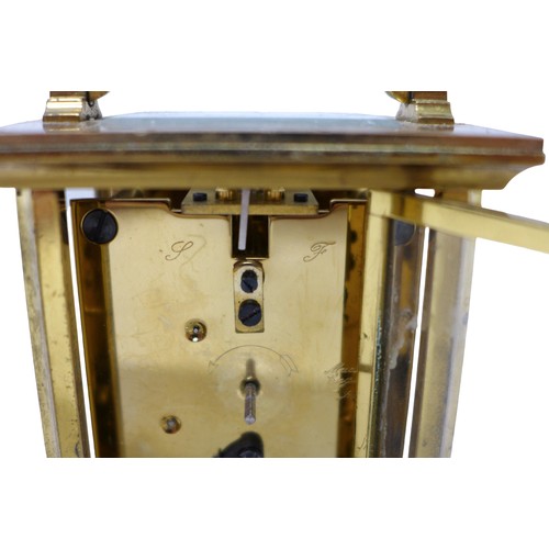 256 - A brass carriage clock signed Bernard Freres, 8 by 6 by 14.5 cm.