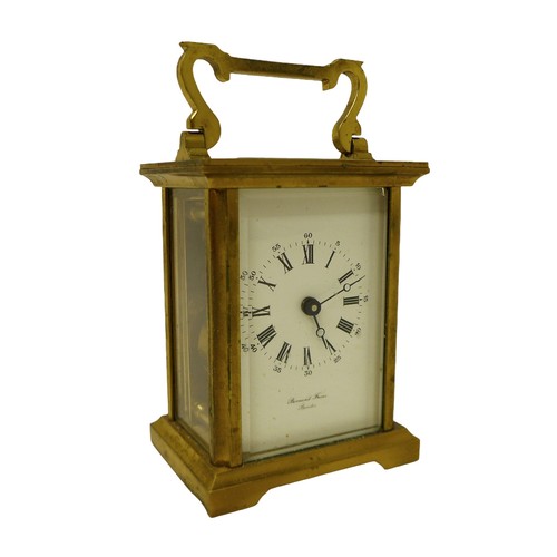 256 - A brass carriage clock signed Bernard Freres, 8 by 6 by 14.5 cm.