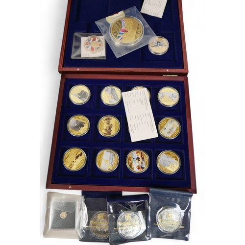 111 - A collection of WWII related Windsor Mint commemorative coins, housed in eight coin boxes and loose,... 