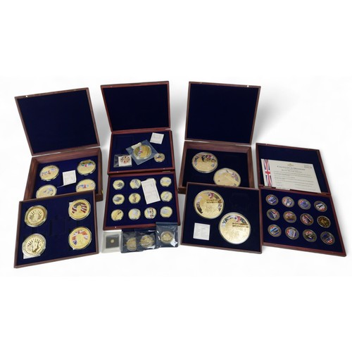 111 - A collection of WWII related Windsor Mint commemorative coins, housed in eight coin boxes and loose,... 