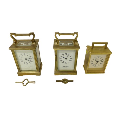 260 - Two brass carriage clocks and an alarm clock, carriage clocks measure 8 by 6 by 15cm high with handl... 