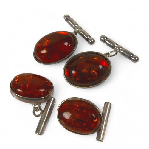 17 - A collection of silver and costume jewellery, including amber cufflinks. (8)