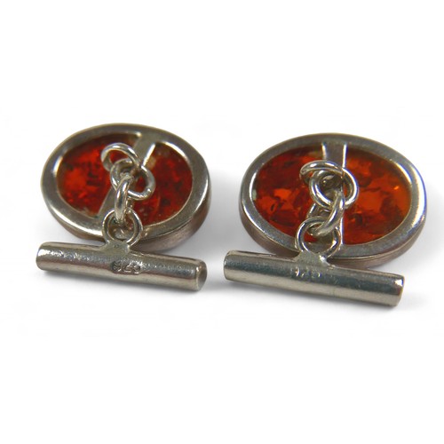 17 - A collection of silver and costume jewellery, including amber cufflinks. (8)