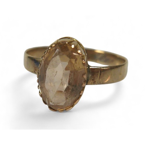 12 - A 9ct yellow gold ring, a 9ct silver ring and a gilt metal citrine ring, 9ct ring is missing a stone... 