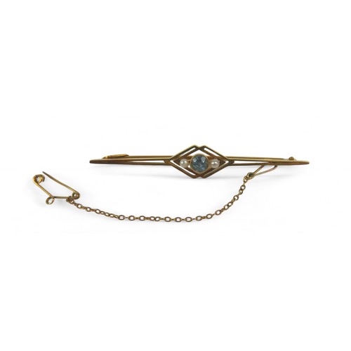 25 - A 15ct gold brooch, 55mm, together with two jade pendants, one with a 9ct mount, 3.6g. (3)