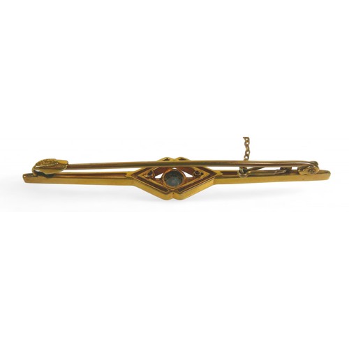 25 - A 15ct gold brooch, 55mm, together with two jade pendants, one with a 9ct mount, 3.6g. (3)