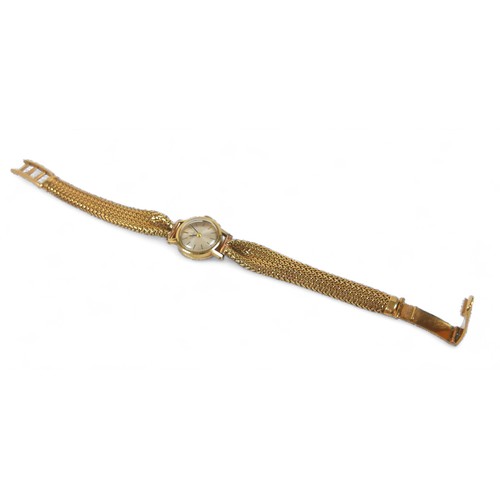 157 - A 14 ct yellow gold Tissot ladies wristwatch on an 18ct bracelet strap, 17mm case, manual wind, 18cm... 