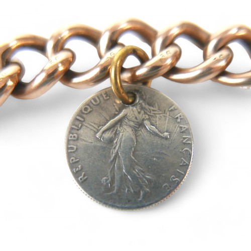 61 - A 9ct gold chain bracelet with padlock clasp, attached with a WWI silver related French coin and US ... 