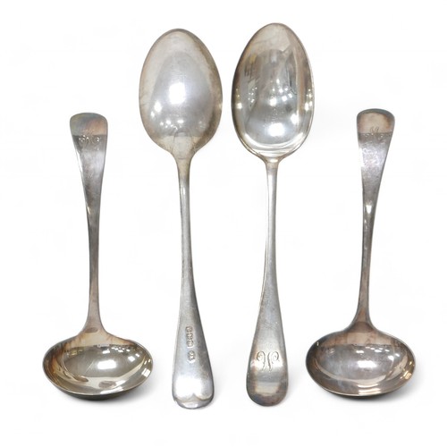 75 - Four George V silver spoons, comprising two sauce ladles and two table spoons, all terminals initial... 