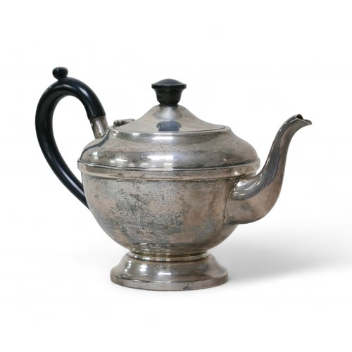 83 - A George V and later silver bachelor's associated three-piece tea service, comprising a teapot with ... 