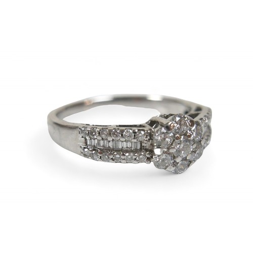 47 - An 18ct white gold and diamond ring, with central flower head setting, made of seven round cut diamo... 