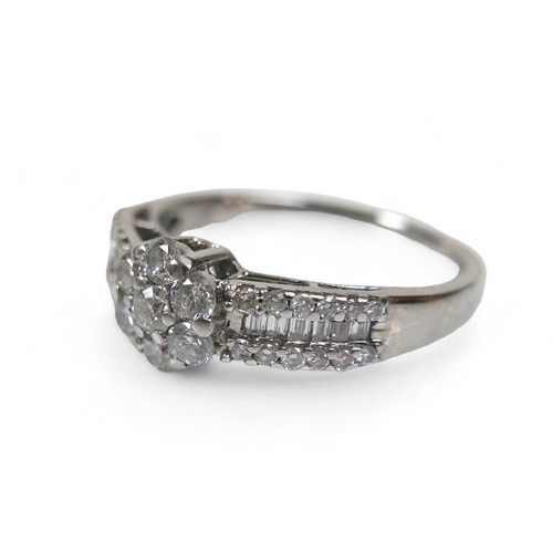 47 - An 18ct white gold and diamond ring, with central flower head setting, made of seven round cut diamo... 