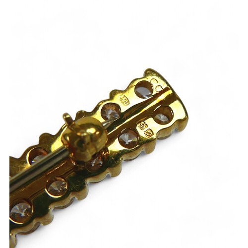 51 - An 18ct gold and diamond double row bar brooch, made up of 34 round, brilliant cut stones, each 2.70... 