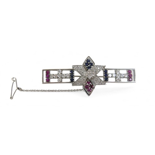 54 - A sapphire, ruby and diamond set 18ct white gold brooch, comprising a open bar form with six sided s... 