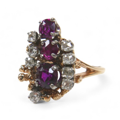 48 - A 14ct gold diamond and ruby cluster ring, featuring eight round cut diamonds and three graduated ru... 