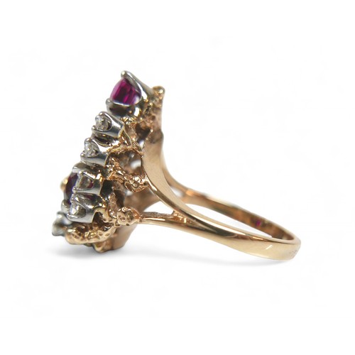 48 - A 14ct gold diamond and ruby cluster ring, featuring eight round cut diamonds and three graduated ru... 