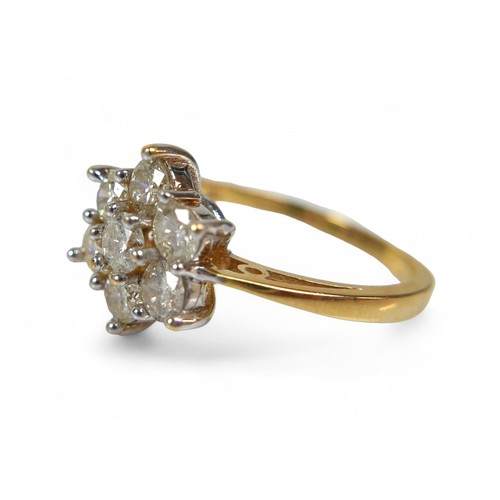 8 - An 18ct yellow gold and diamond ring, the seven round cut diamonds set in a flower head pattern, cen... 