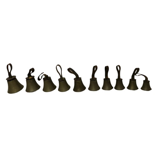 232 - A set of twenty four hand bells, by J. Shaw Son & Company, Bradford, graduating sizes, with brown le... 