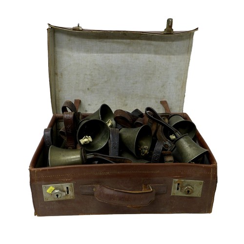 232 - A set of twenty four hand bells, by J. Shaw Son & Company, Bradford, graduating sizes, with brown le... 