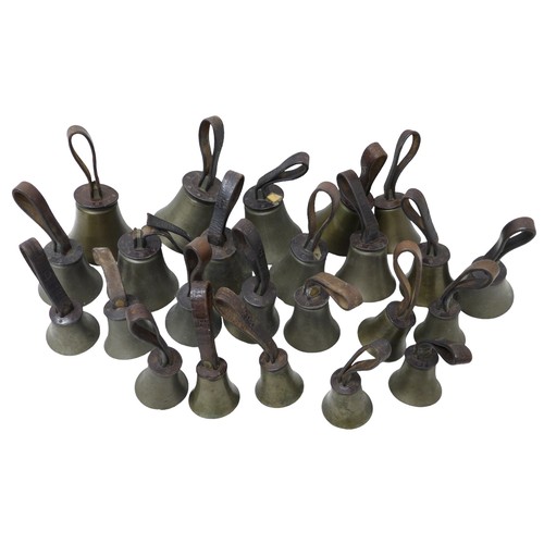 232 - A set of twenty four hand bells, by J. Shaw Son & Company, Bradford, graduating sizes, with brown le... 