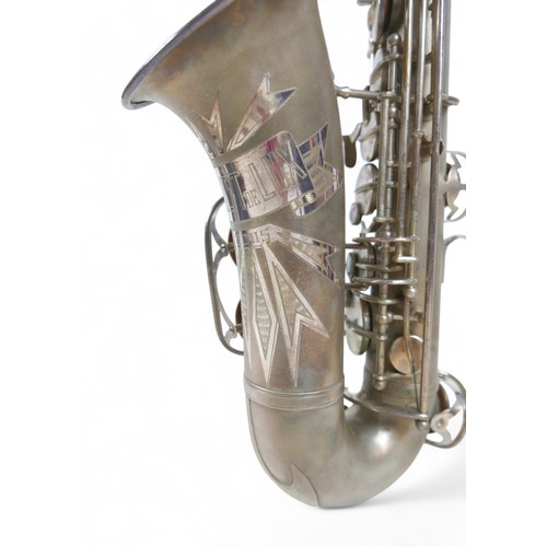 230 - A silver plated Weltklang Solist de Lux saxophone, in original box.