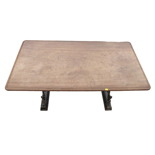 334 - A cast iron pub table with a mahogany top, 112 by 57 by 74cm.