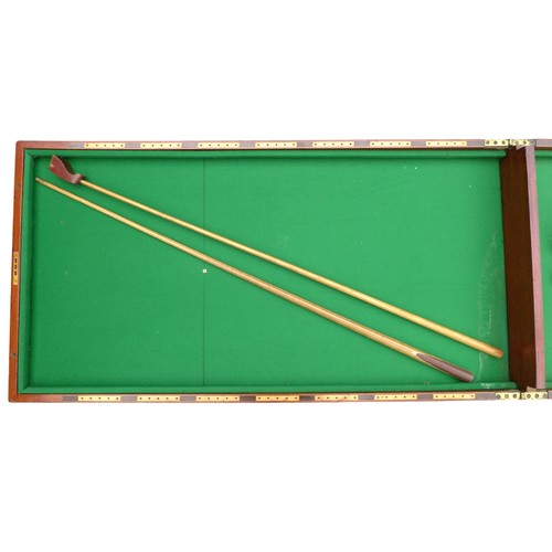 243 - A Victorian mahogany table top bagatelle game with cue and rules, 244 by 63 by 6cm high open.