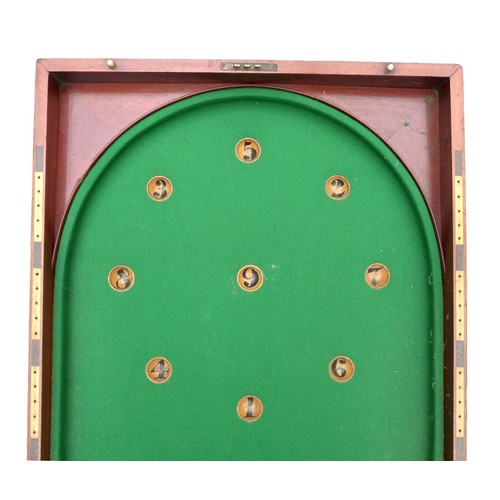 243 - A Victorian mahogany table top bagatelle game with cue and rules, 244 by 63 by 6cm high open.