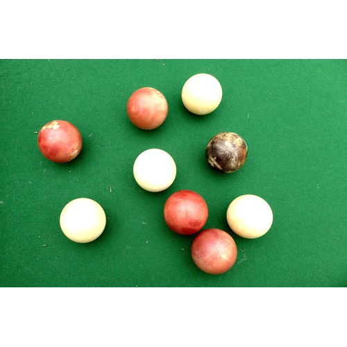 243 - A Victorian mahogany table top bagatelle game with cue and rules, 244 by 63 by 6cm high open.