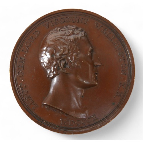 108 - An 1810 British Victories in Peninsular War bronze medal, by T. Wyon Jr., 60.6g.