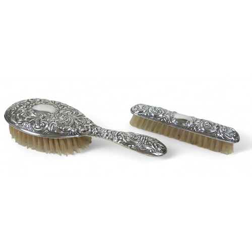 67 - A silver dressing table set, comprising a hairbrush, handheld mirror, comb, a/f, and a brush, W I Br... 