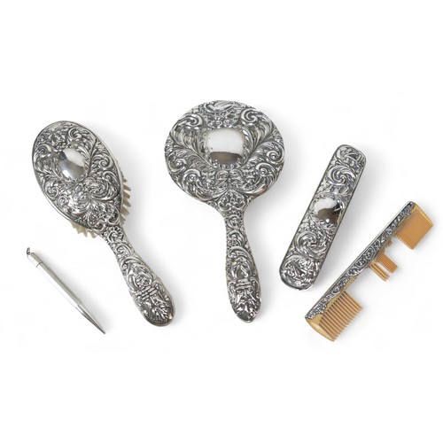 67 - A silver dressing table set, comprising a hairbrush, handheld mirror, comb, a/f, and a brush, W I Br... 