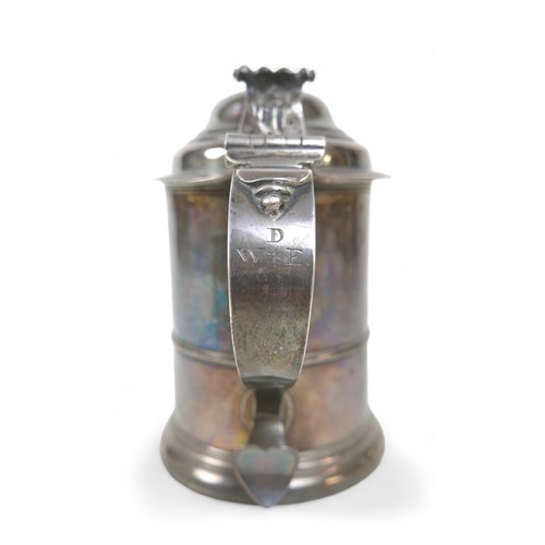 85 - A George II silver lidded tankard, domed cover, scroll thumbpiece, skirted base, engraved to handle,... 