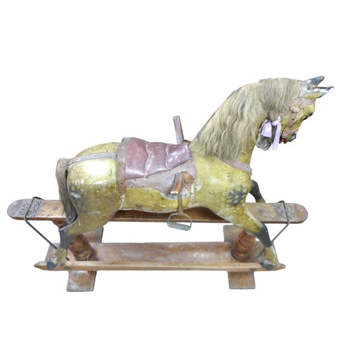 245 - A large Victorian dapple grey painted rocking horse, with leather saddle and tack, 152 by 40 by 126c... 